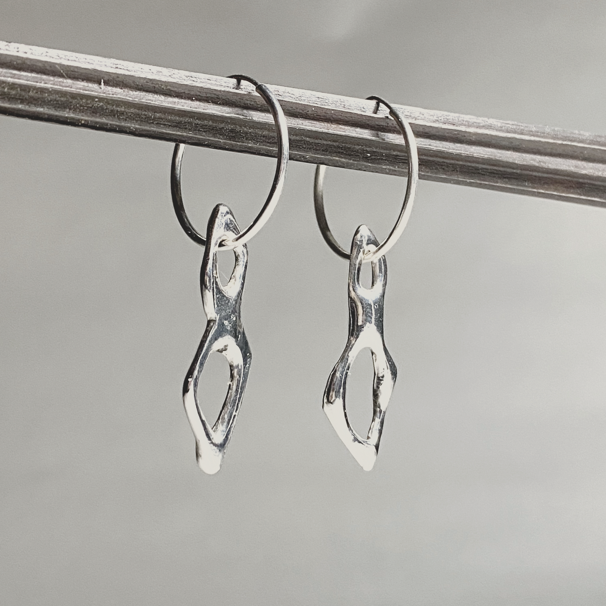 spite is infinite earrings